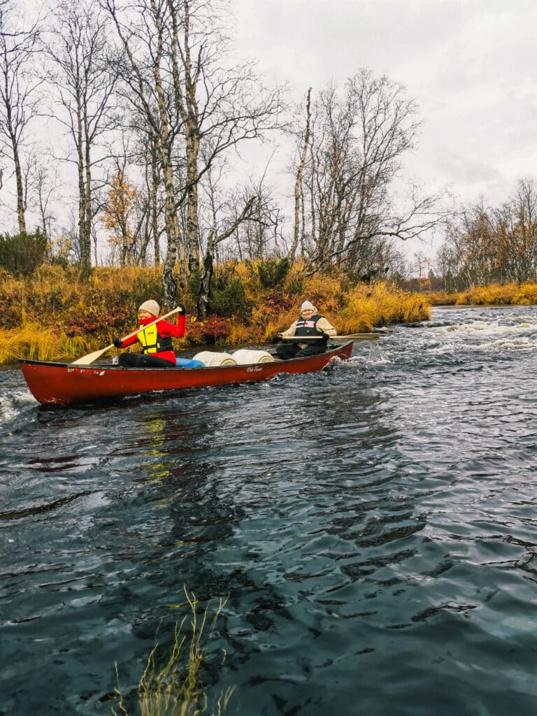 Women are canoeing and kayaking in a river in Hetta Enontekiö Lapland.